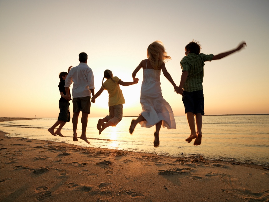 Family Jumping at the Beach